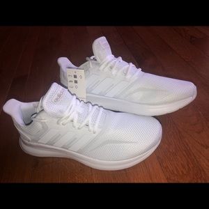 Woman’s size 8.5 white Adidas shoes